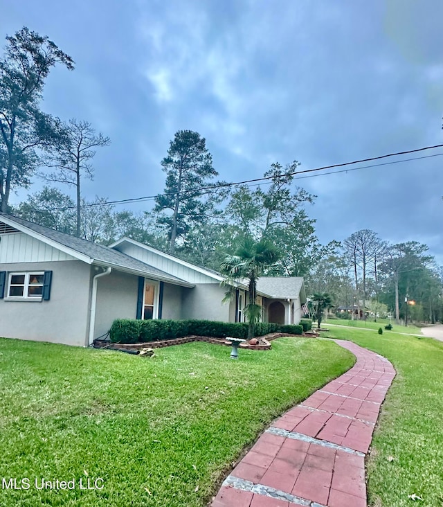 view of property exterior featuring a yard