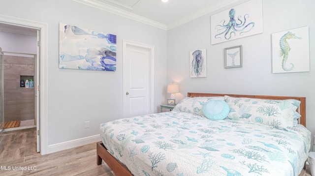 bedroom featuring ornamental molding and hardwood / wood-style floors