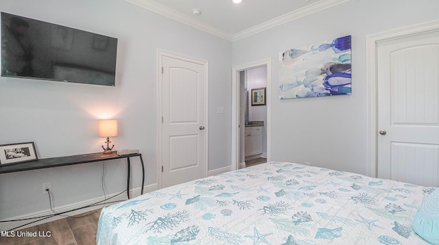 bedroom featuring crown molding and hardwood / wood-style floors