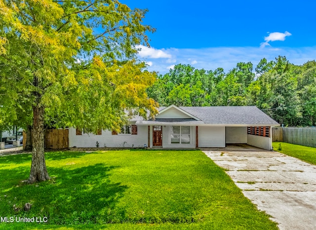 ranch-style home with a front yard and a carport