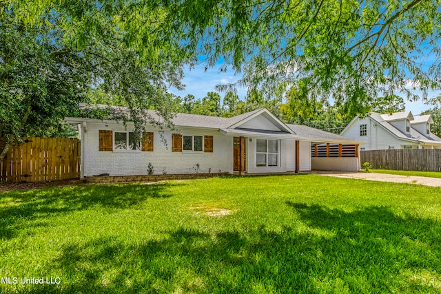 ranch-style home featuring a front yard