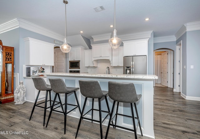 kitchen featuring arched walkways, visible vents, white cabinets, stainless steel refrigerator with ice dispenser, and built in microwave