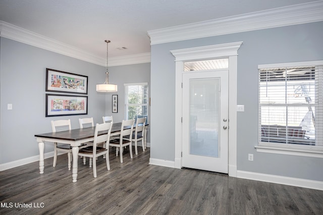 dining room with dark wood-style floors, baseboards, visible vents, and crown molding