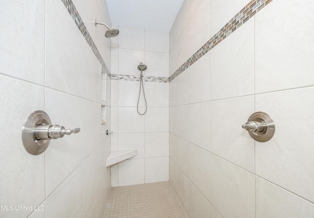 full bathroom with tiled shower