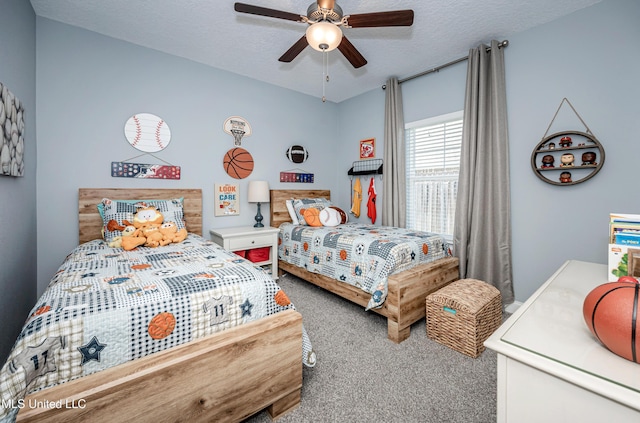 bedroom featuring carpet, ceiling fan, and a textured ceiling