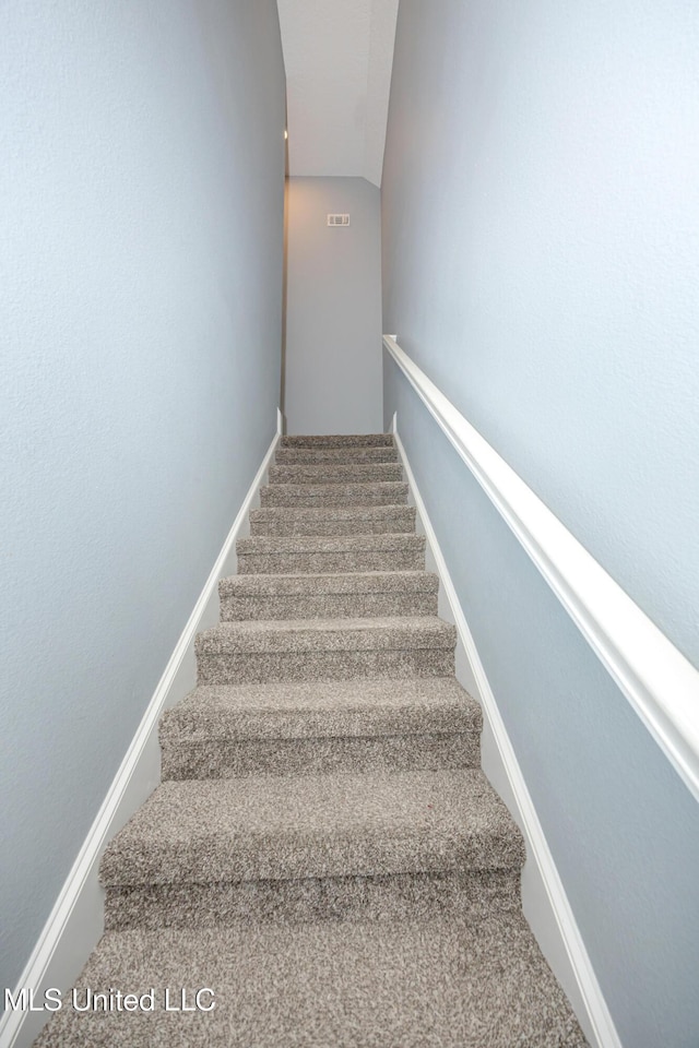 stairway with baseboards