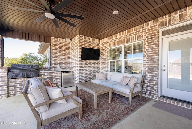 view of patio with an outdoor hangout area, grilling area, a sink, and a ceiling fan