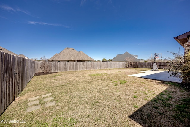 view of yard featuring a fenced backyard