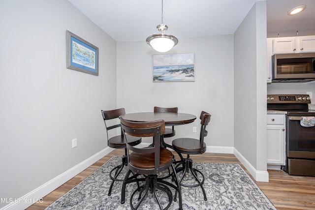 dining area featuring light wood-type flooring