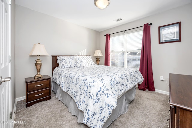 bedroom with light colored carpet