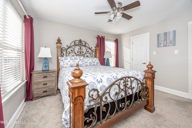 bedroom featuring ceiling fan and light carpet