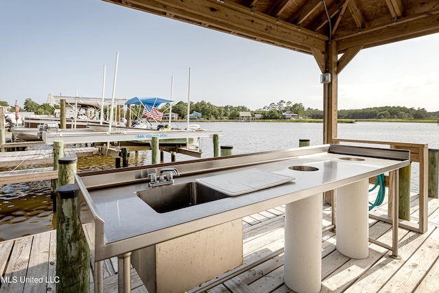 dock area with a water view and sink