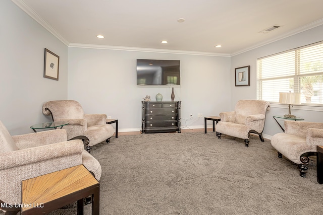 carpeted living room with ornamental molding