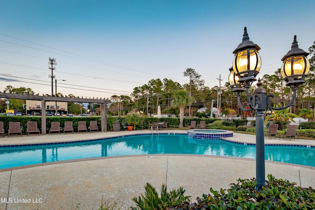 view of pool with a community hot tub and a patio area