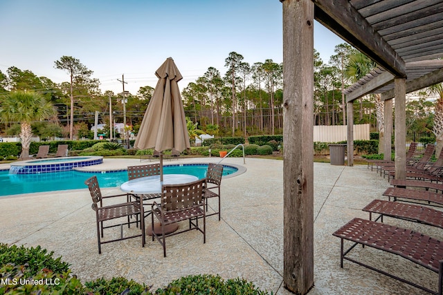 view of pool with a pergola, a patio area, and an in ground hot tub