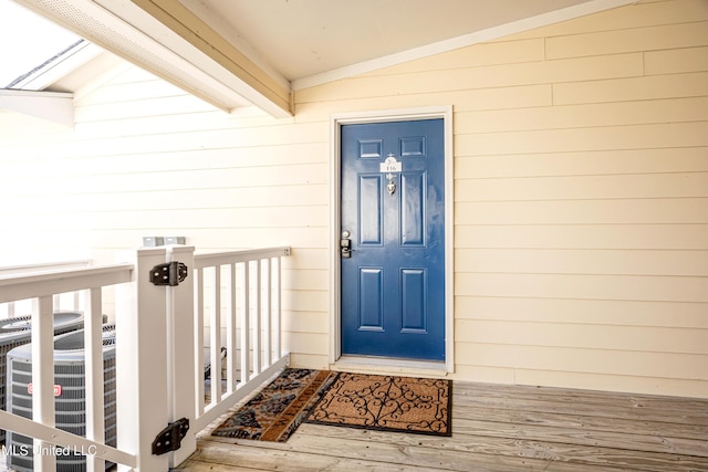 doorway to property featuring central AC unit