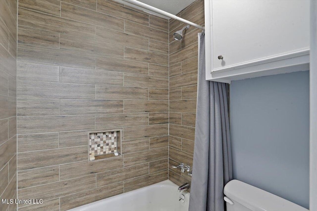 bathroom with toilet and shower / bath combo with shower curtain