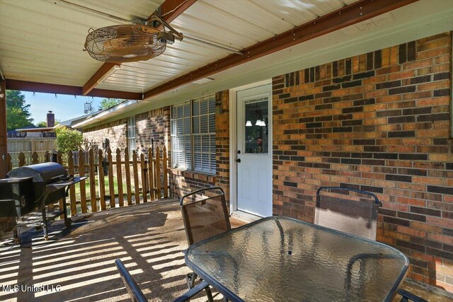 view of patio featuring area for grilling and ceiling fan