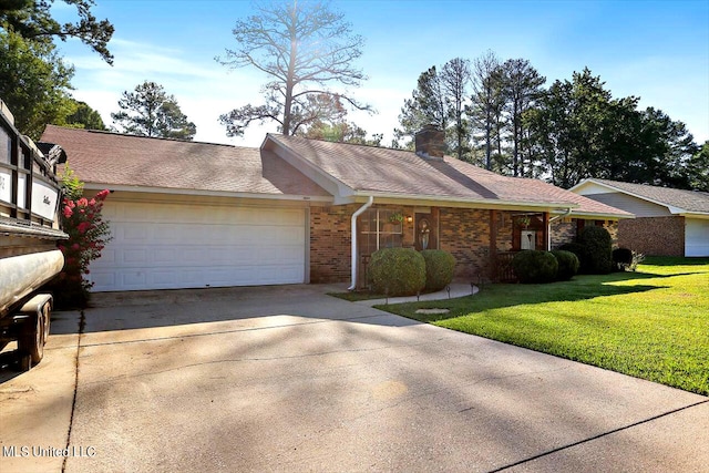 ranch-style home with a garage and a front yard