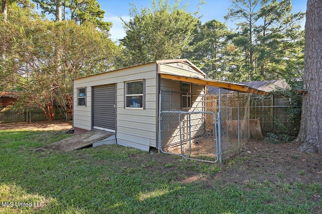 view of outdoor structure with a lawn