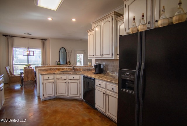 kitchen featuring black appliances, plenty of natural light, kitchen peninsula, and sink