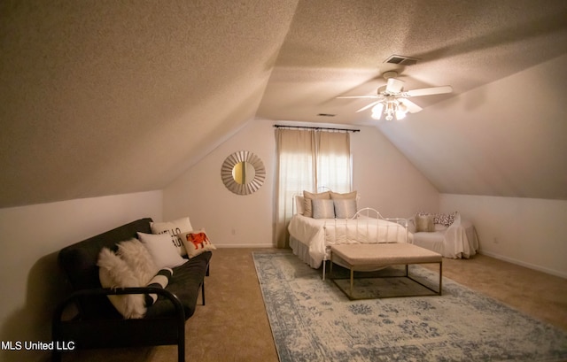 carpeted bedroom featuring a textured ceiling, ceiling fan, and lofted ceiling