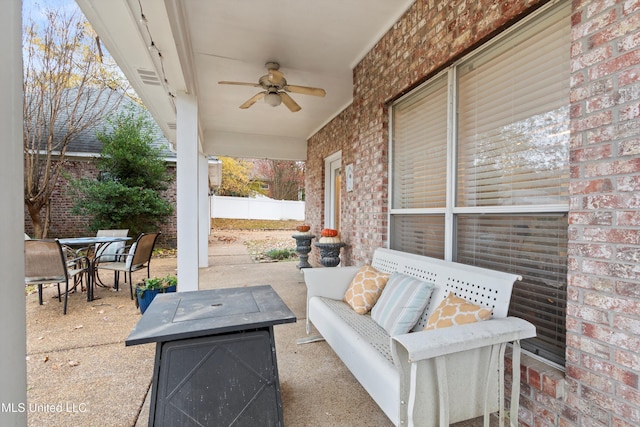 view of patio featuring ceiling fan