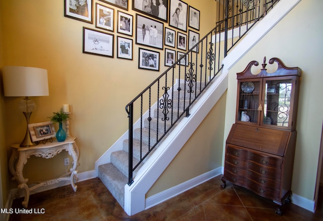 staircase with tile patterned flooring