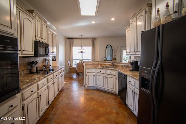 kitchen with kitchen peninsula, backsplash, sink, black appliances, and hanging light fixtures