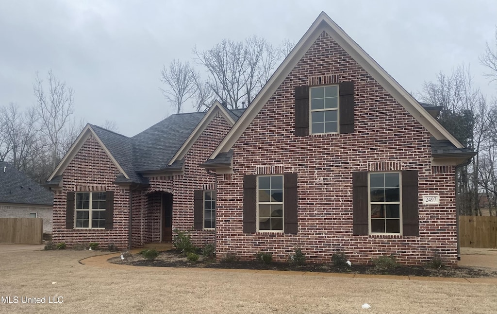 view of property with a front lawn