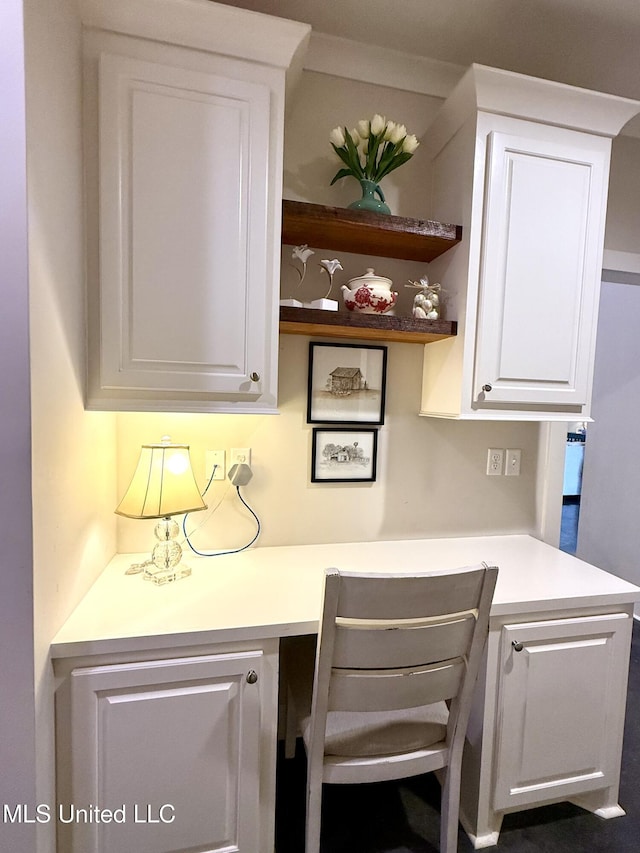 kitchen with white cabinetry, light countertops, and open shelves