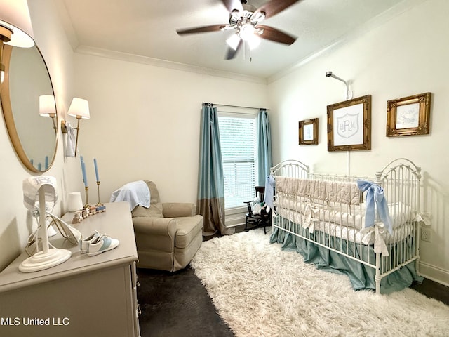 bedroom featuring crown molding, a ceiling fan, and baseboards
