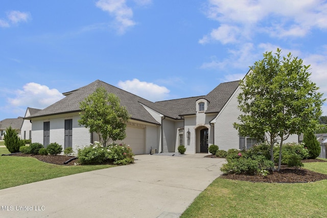 508 Forest Glen Ln, Brandon, MS 39047 - french provincial home featuring driveway, a garage, a front yard, and a shingled roof