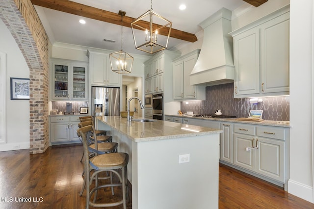 508 Forest Glen Ln, Brandon, MS 39047 - kitchen with custom range hood, stainless steel appliances, tasteful backsplash, dark wood-style floors, and beamed ceiling