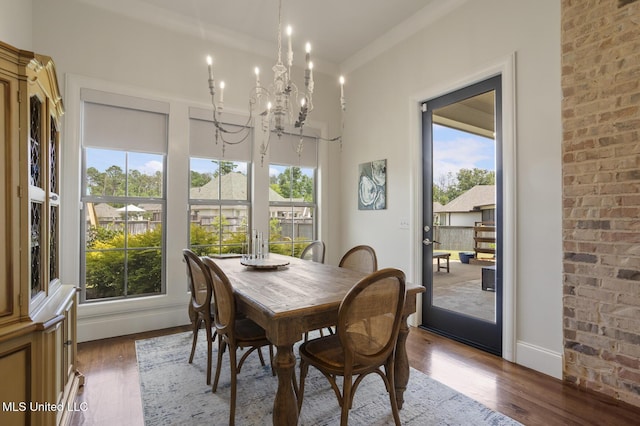 508 Forest Glen Ln, Brandon, MS 39047 - dining area with plenty of natural light, wood finished floors, and a chandelier