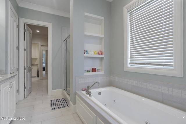 508 Forest Glen Ln, Brandon, MS 39047 - bathroom with a jetted tub, tile patterned flooring, vanity, a stall shower, and built in shelves