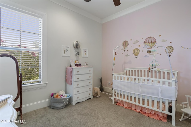 508 Forest Glen Ln, Brandon, MS 39047 - bedroom featuring a nursery area, carpet, ornamental molding, and ceiling fan