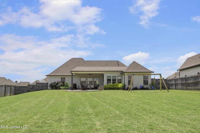 508 Forest Glen Ln, Brandon, MS 39047 - back of house with a ceiling fan, a patio, a fenced backyard, stucco siding, and a playground