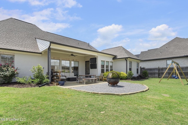 508 Forest Glen Ln, Brandon, MS 39047 - back of house with ceiling fan, a playground, a patio area, a fenced backyard, and an outdoor living space with a fire pit