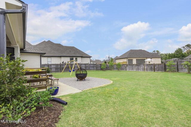 508 Forest Glen Ln, Brandon, MS 39047 - fenced backyard featuring a playground and a patio