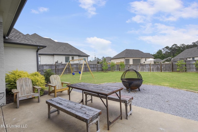508 Forest Glen Ln, Brandon, MS 39047 - fenced backyard featuring an outdoor fire pit, a patio, and a playground