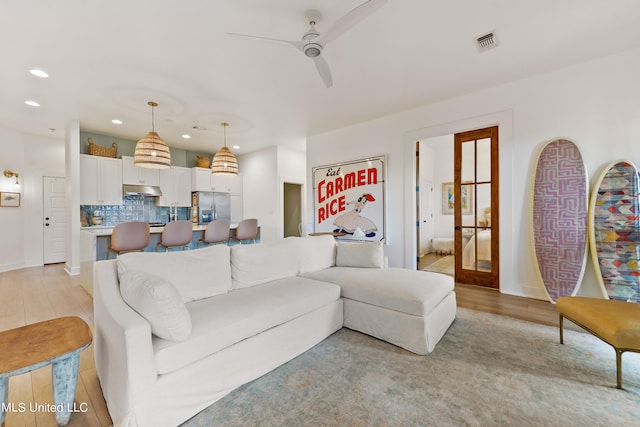 218 Front St, Pass Christian, MS 39571 - living area with recessed lighting, a ceiling fan, and baseboards