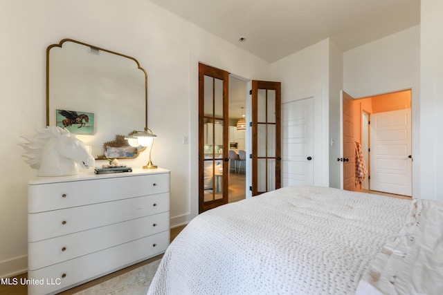 218 Front St, Pass Christian, MS 39571 - bedroom featuring french doors