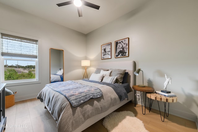 218 Front St, Pass Christian, MS 39571 - bedroom with light wood finished floors, baseboards, and a ceiling fan