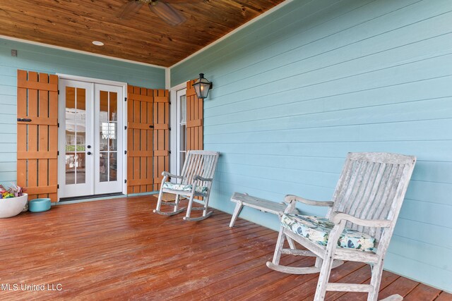 218 Front St, Pass Christian, MS 39571 - wooden terrace with french doors and a ceiling fan