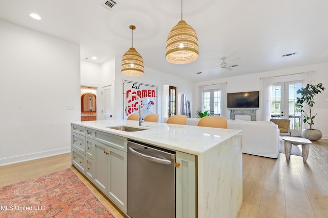 218 Front St, Pass Christian, MS 39571 - kitchen with dishwasher, a sink, light wood-type flooring, french doors, and decorative light fixtures