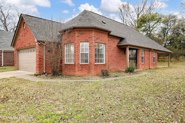 view of front of property with an attached garage, brick siding, a shingled roof, concrete driveway, and a front lawn