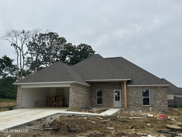 337 Willow Way, Canton, MS 39046 - view of front of house with brick siding, roof with shingles, and concrete driveway