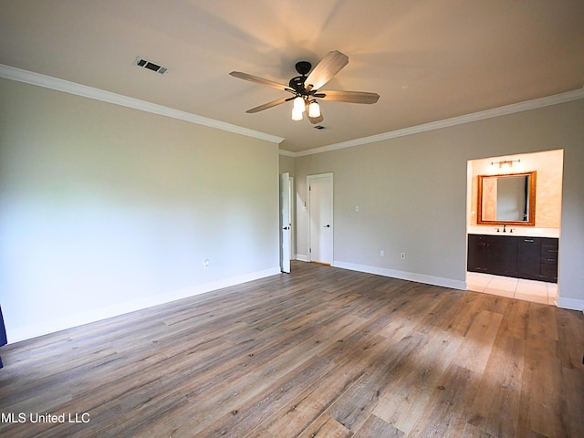 6936 Aulena Pl, Diamondhead, MS 39525 - spare room featuring wood finished floors, ceiling fan, and ornamental molding
