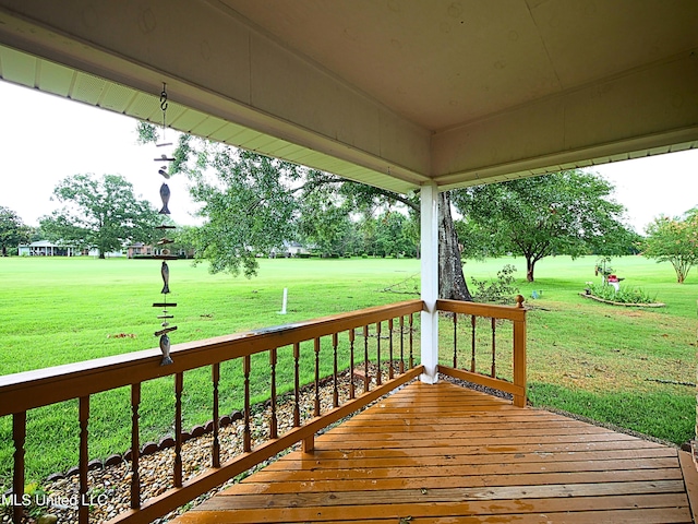 6936 Aulena Pl, Diamondhead, MS 39525 - wooden deck featuring a lawn